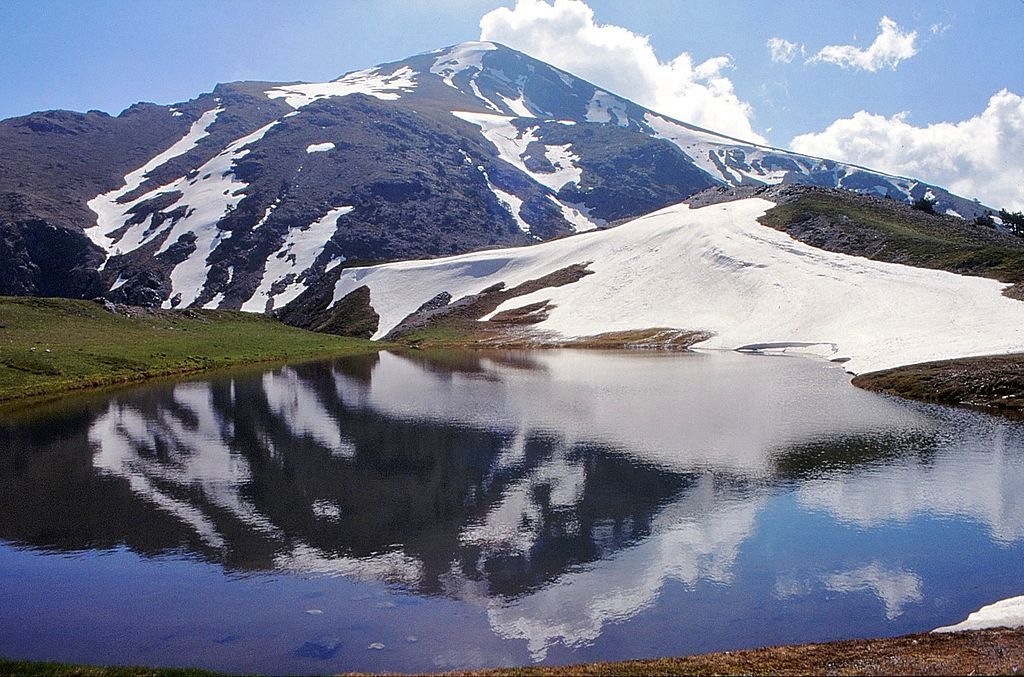 the smolikas mountain reflected on the drakon lake in Epirus
