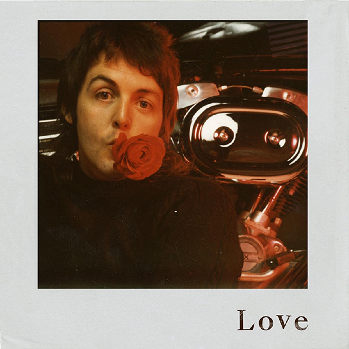 Photo of 'Love' EP artwork which includes a portrait of Paul with a rose in his mouth.