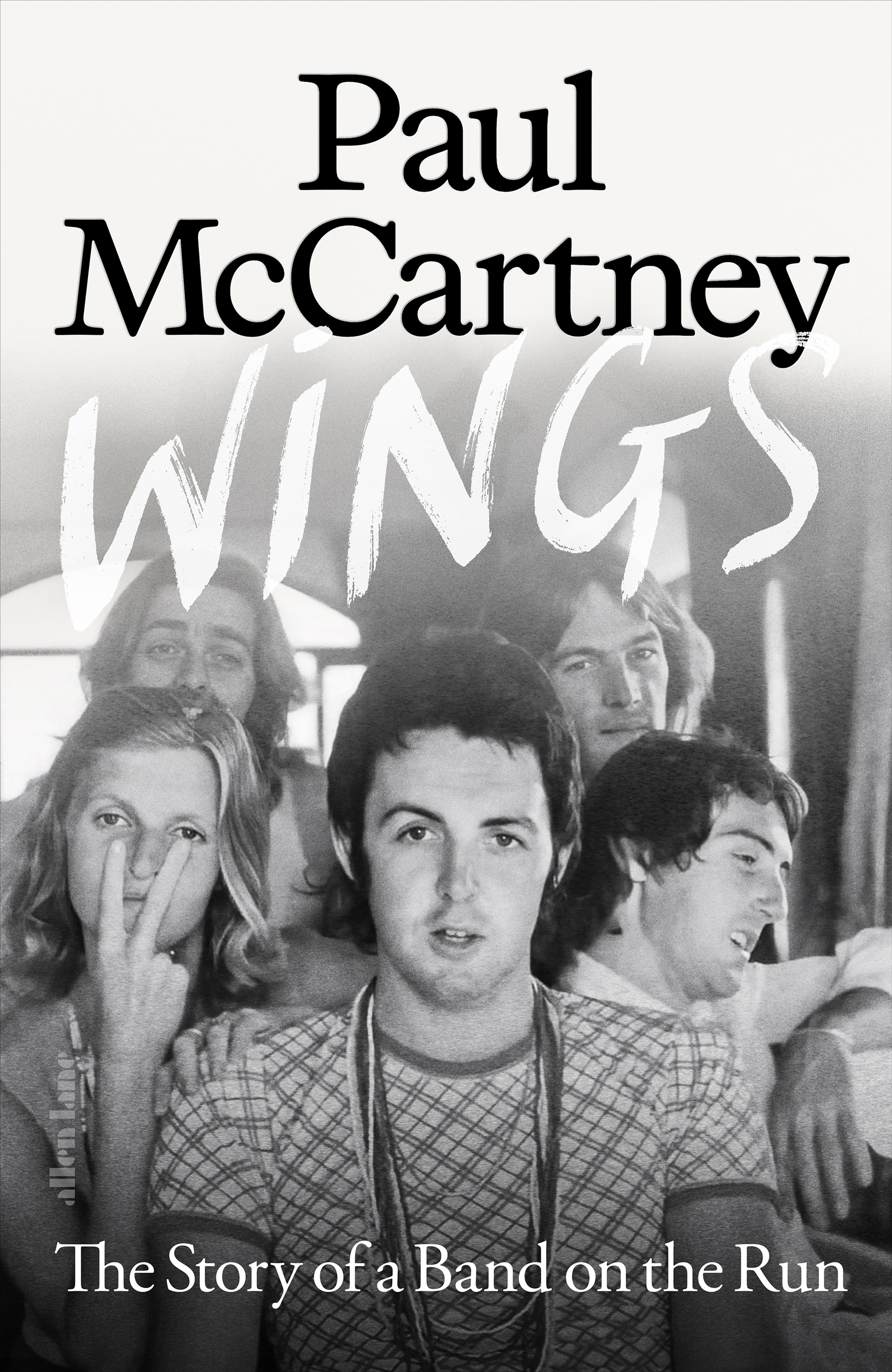 Black and white cover photo of Wings with 'Wings: The Story of a Band on the Run' text overlaid