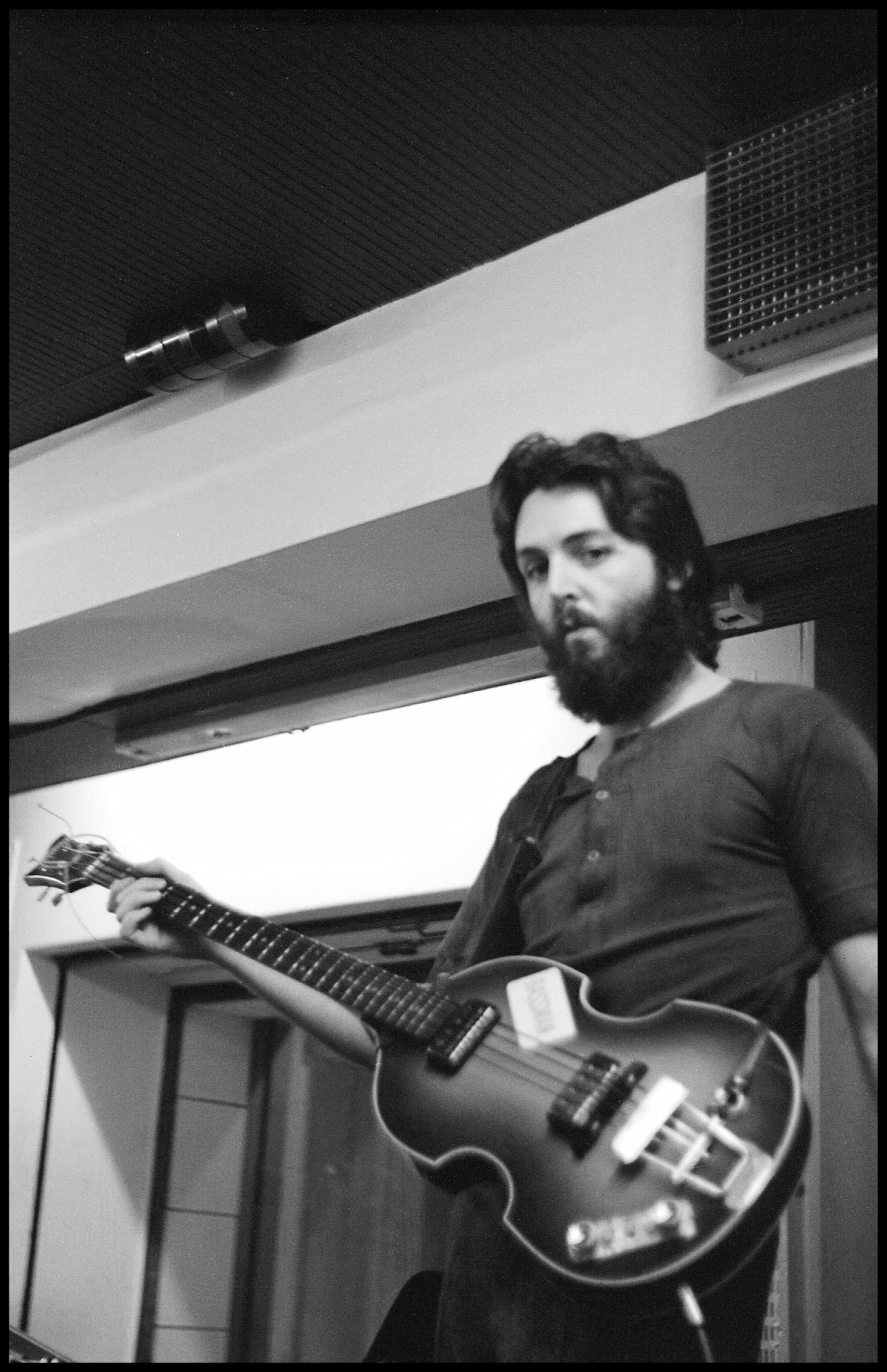 Black and white photo of Paul during the 'McCartney' Recording Sessions in Abbey Road with his Höfner bass.
