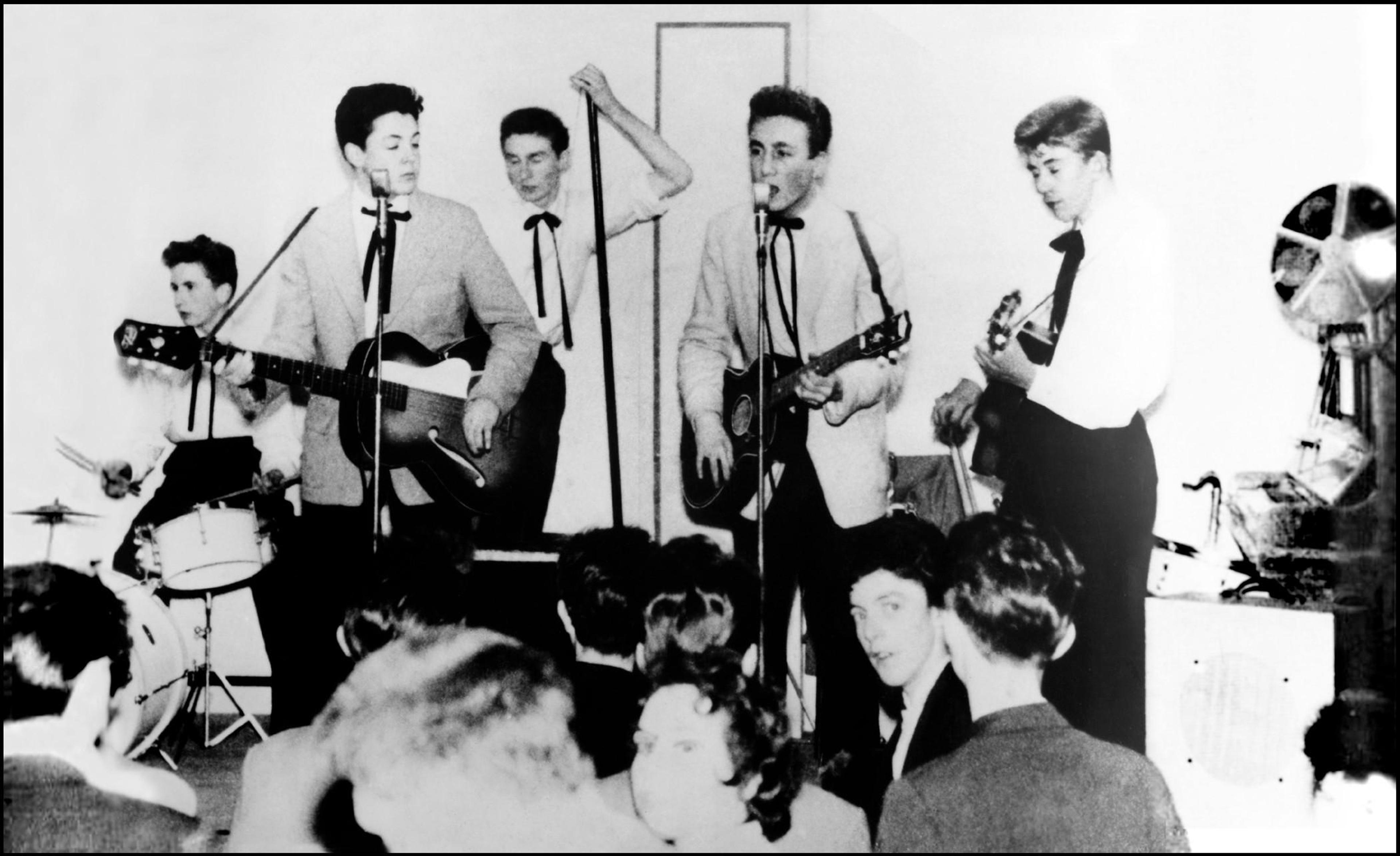 This photo of John, Paul & the Quarrymen playing at New Clubmoor Hall in late 1957, was taken by Lesley Kearney