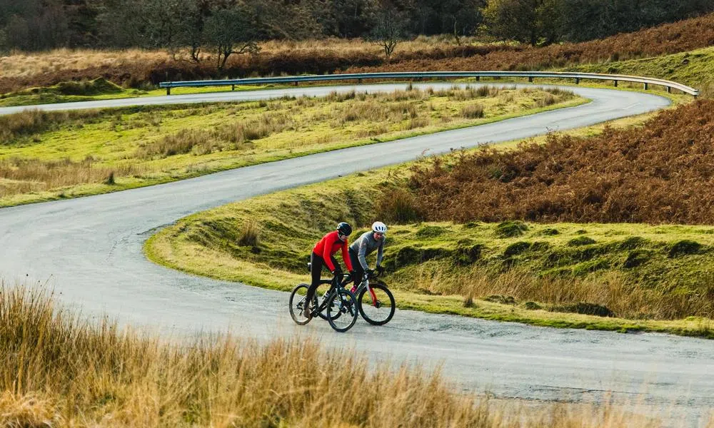 cyclists riding through hairpins