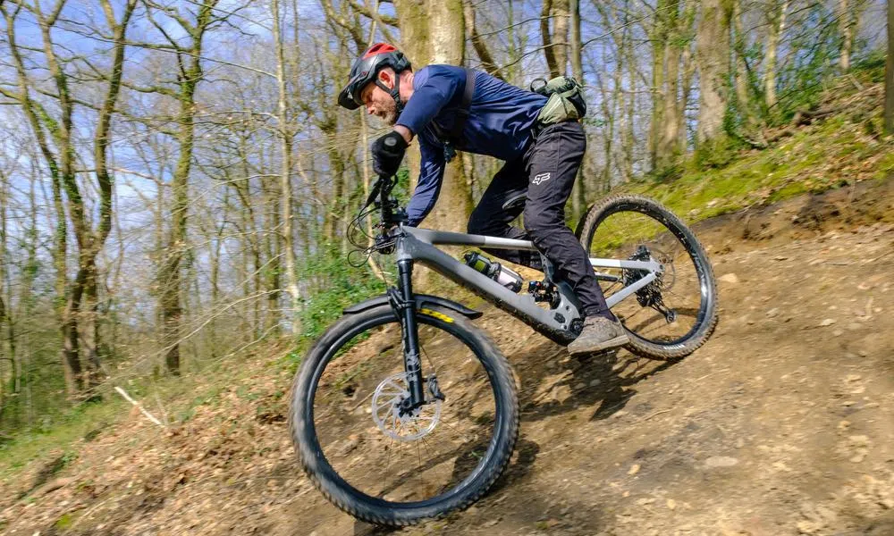 mountain biker on woods trail wearing gopro camera