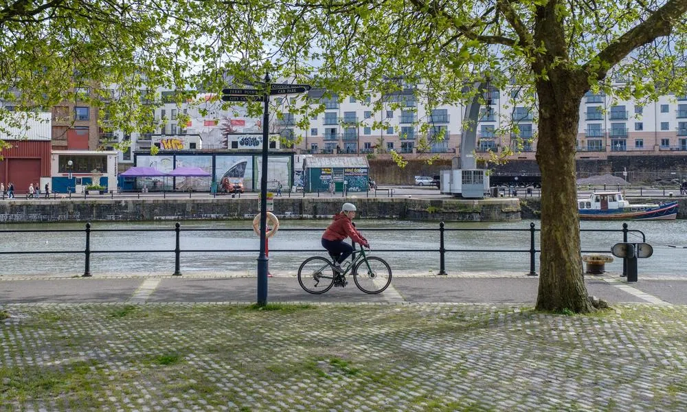 hybrid bike riding along dock side