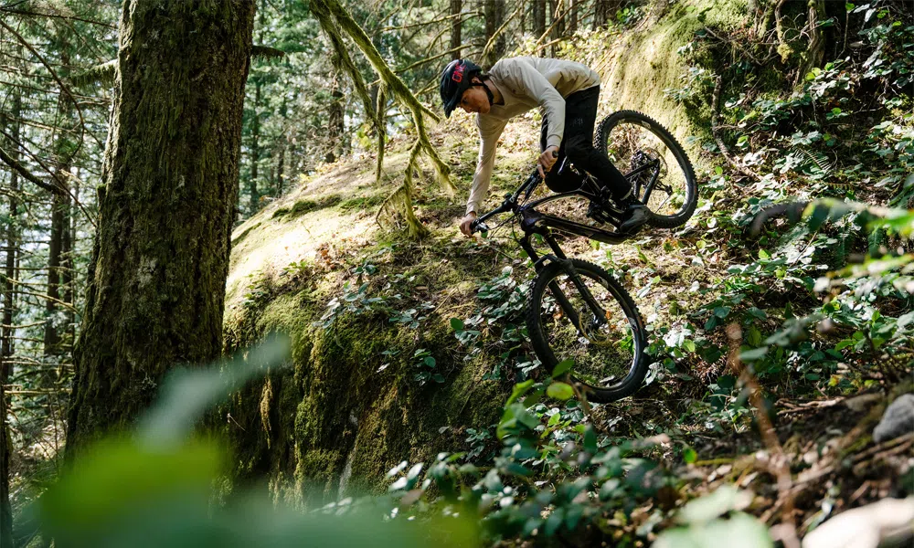 A GT mountain bike is ridden down a steep drop