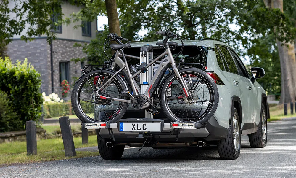 bikes on the back of a car on a bike rack