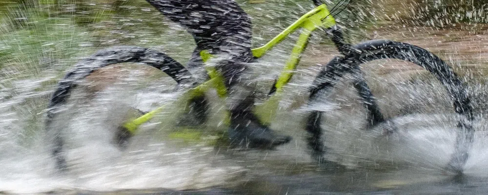 riding through a river with a big splash