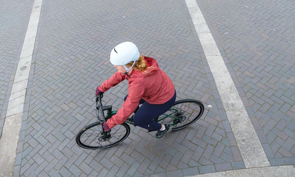 female cyclist on cannondale hybrid bike