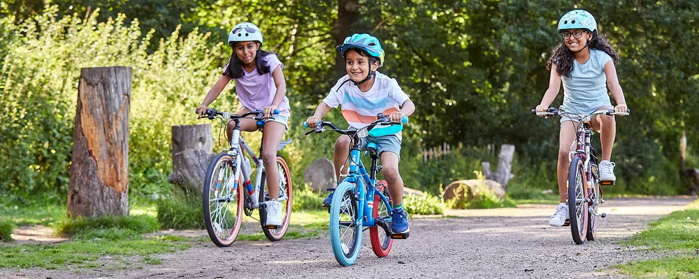 3 Kids riding junior bikes