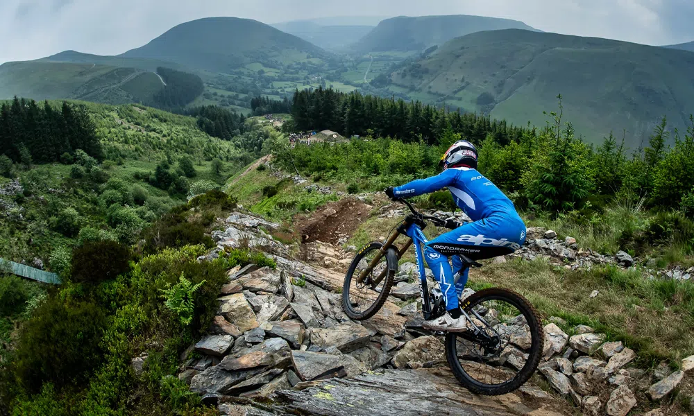 a Mondraker downhill bike is ridden on Hardline race track in North Wales