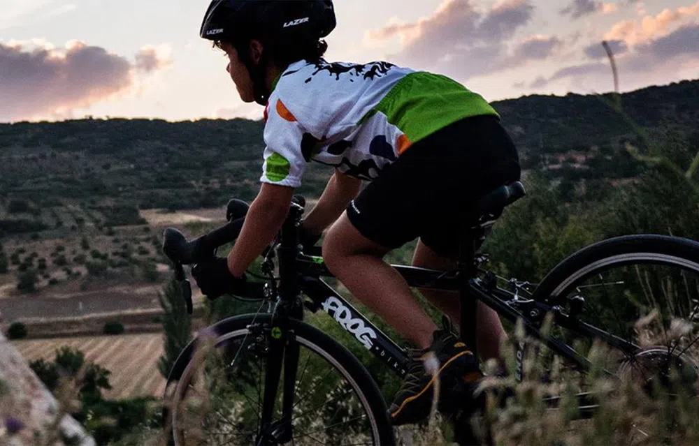 Child riding a Frog road bike