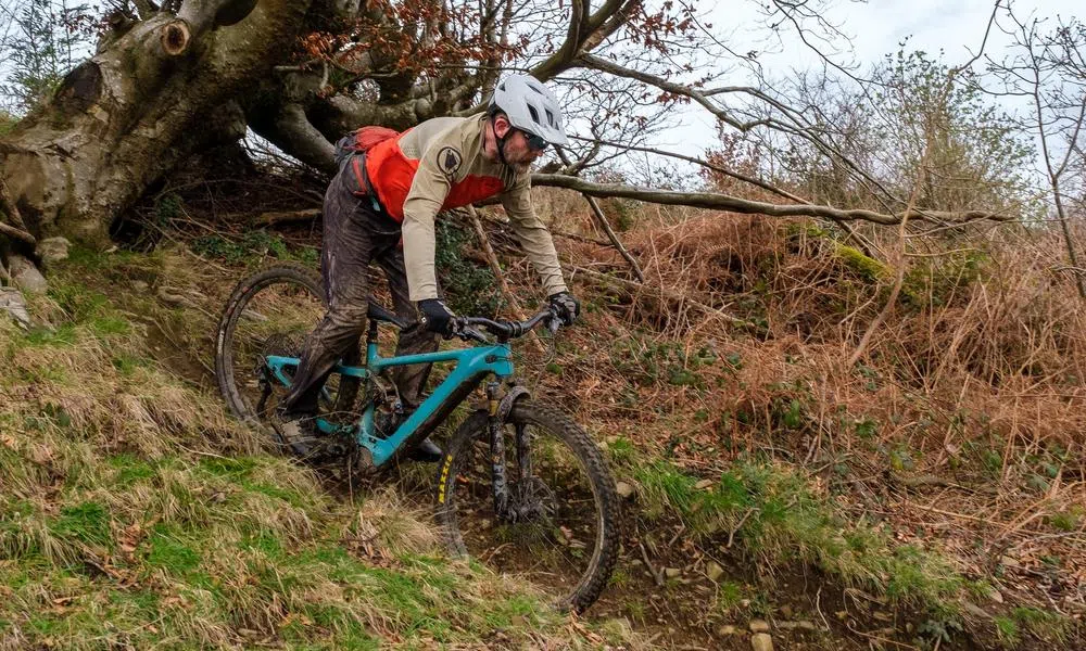 mountain biker on muddy descent