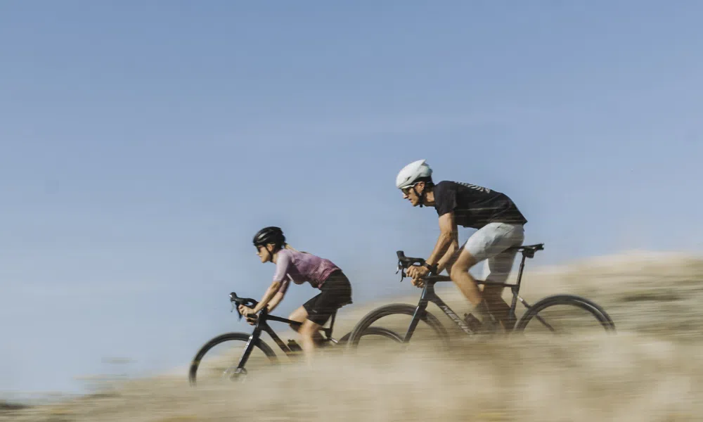 merida gravel bikes are ridden at speed in the sun