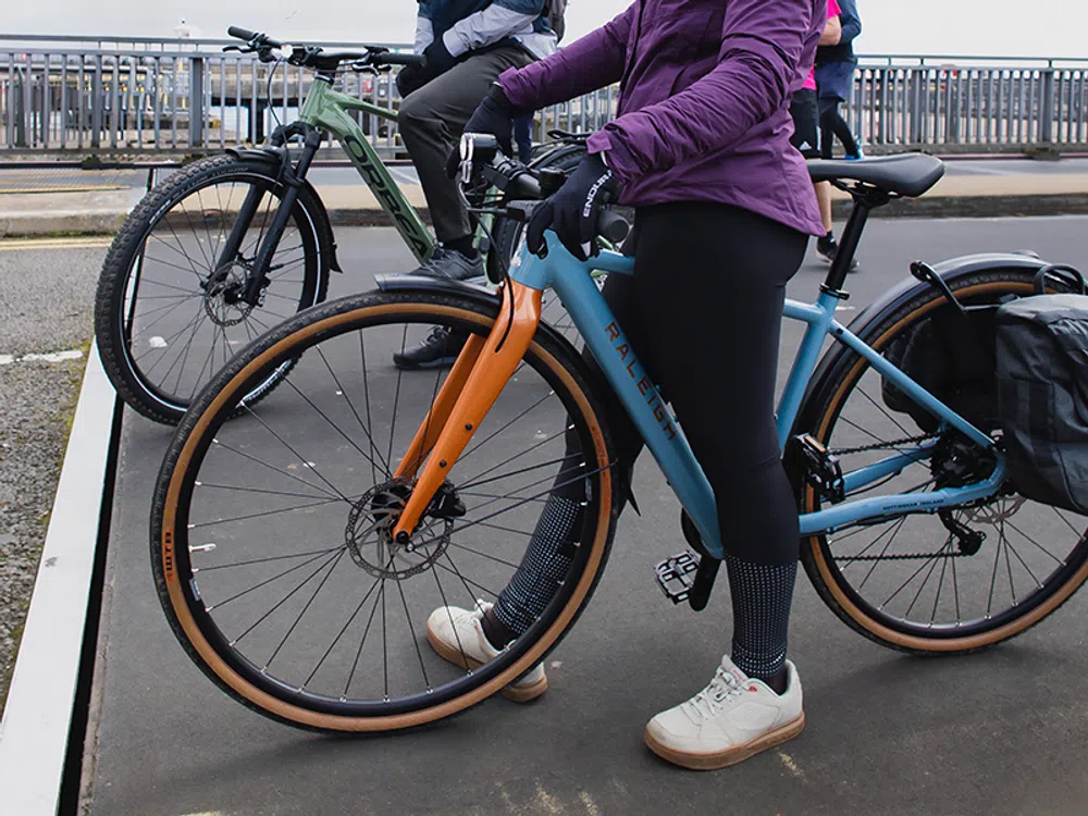 a close up of the tyres on a hybrid bike