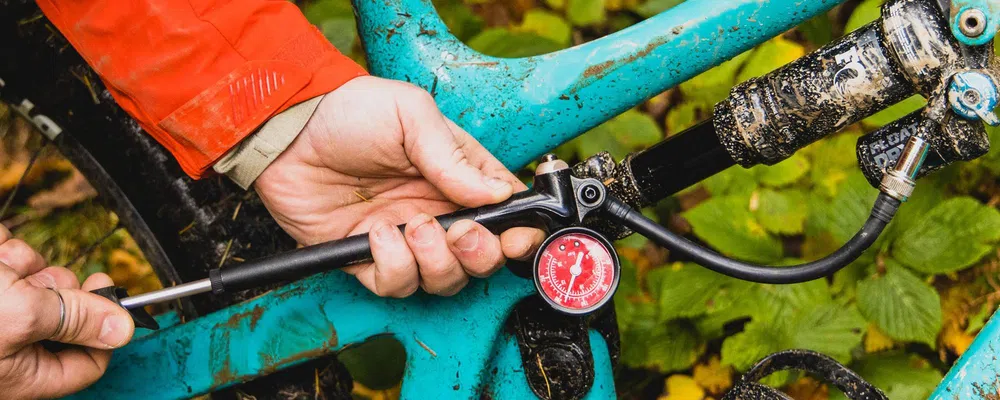 pumping up a rear shock on a yeti mtb