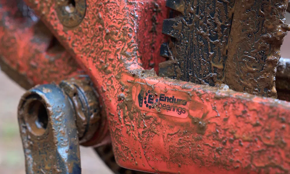 enduro bearings logo on muddy bike 