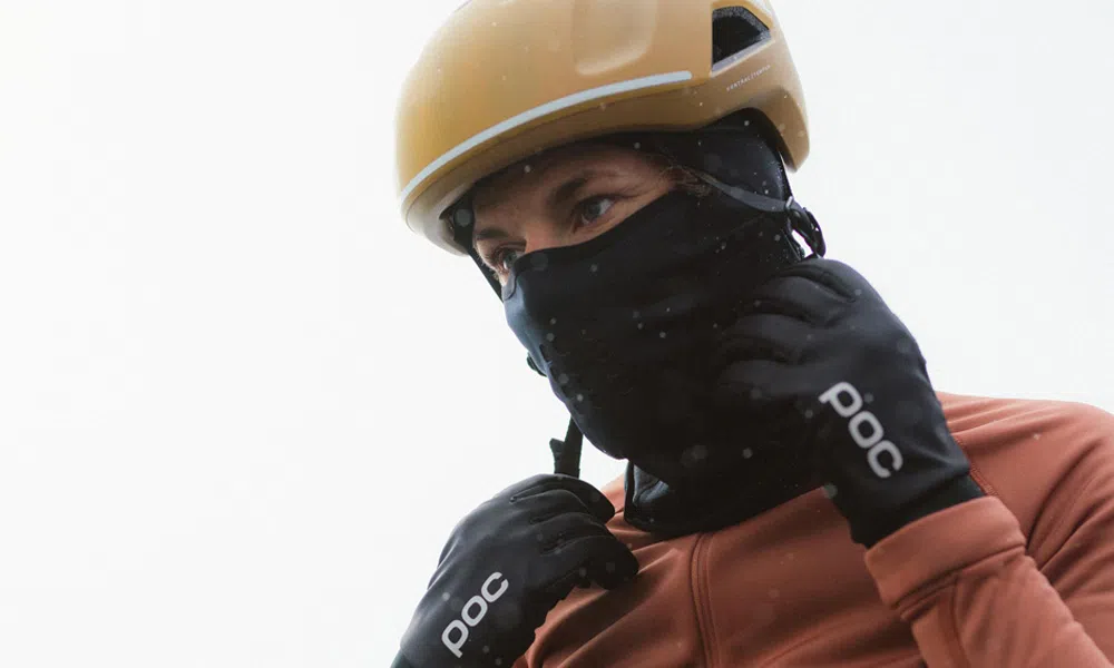 poc helmet, face warmer, jacket and gloves in the rain