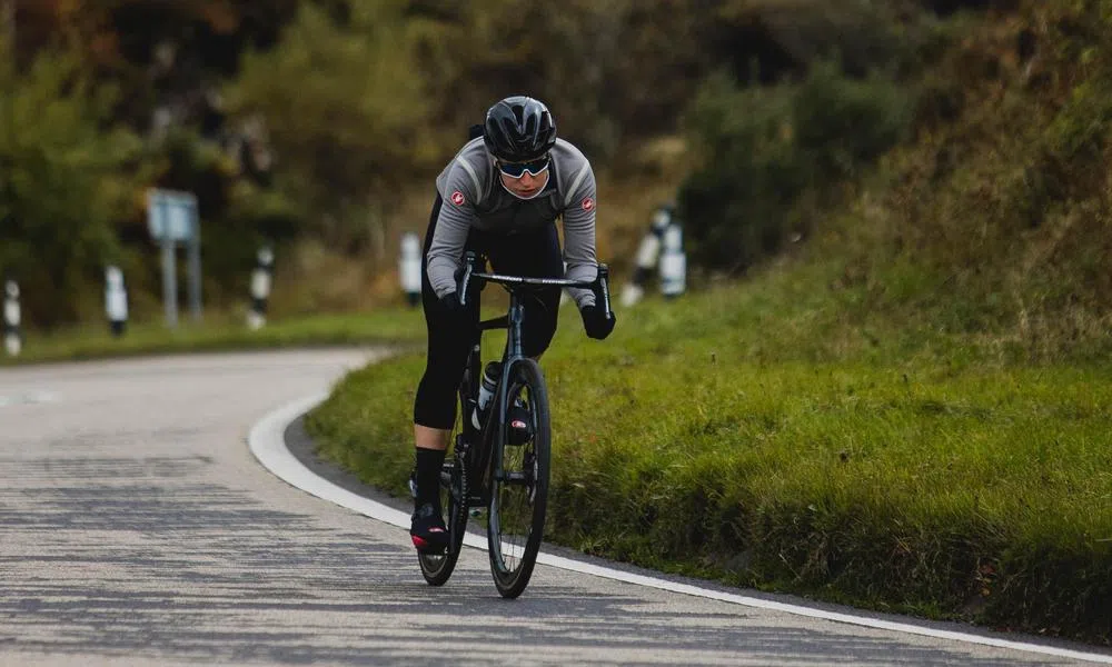 Road rider corning wearing sunglasses