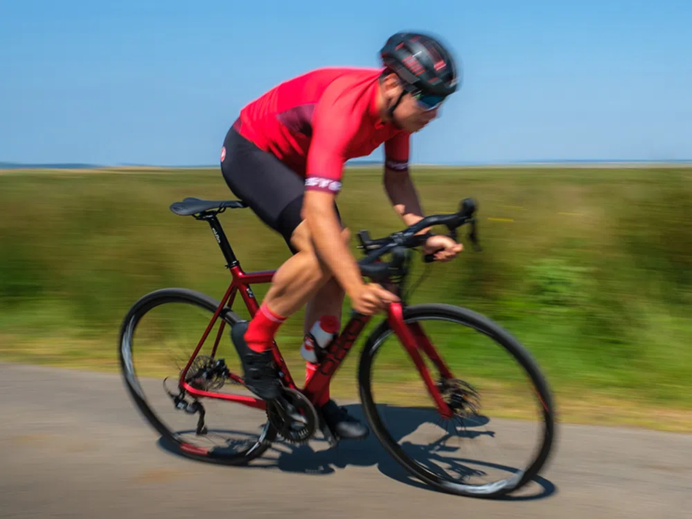 a road bike rides past at speed