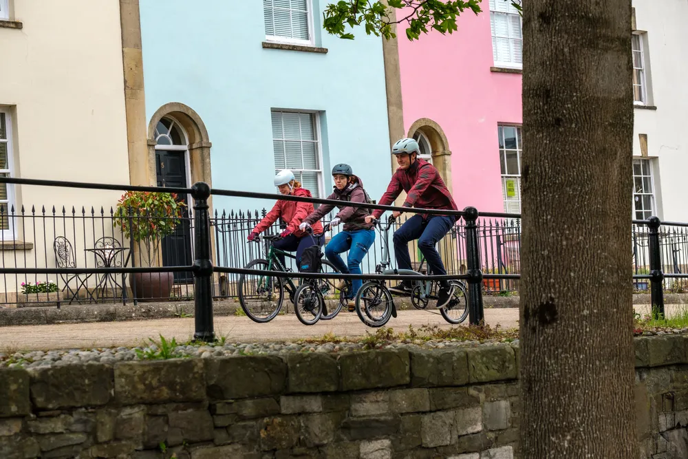 three commuters having fun on a gentle ride on a crisp spring day