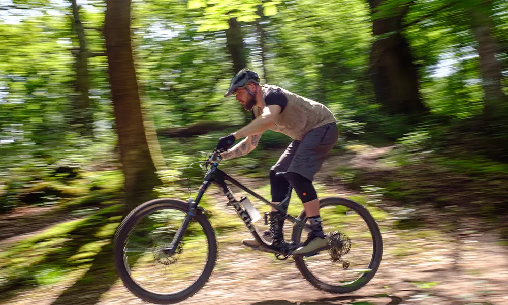 Mountain biker descending a trail in clyne