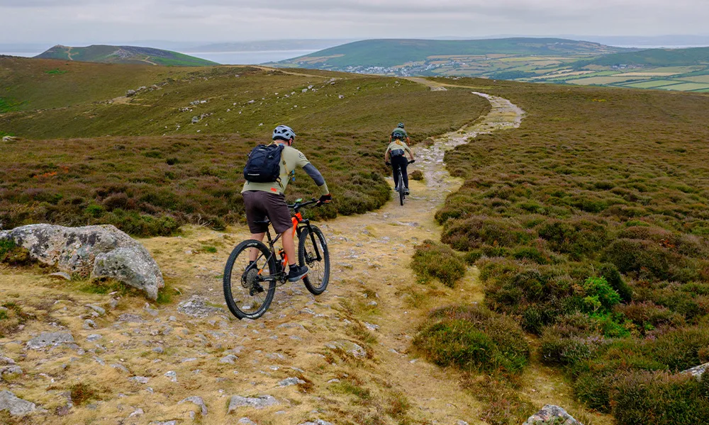 Mountain bikers riding a trail in gower