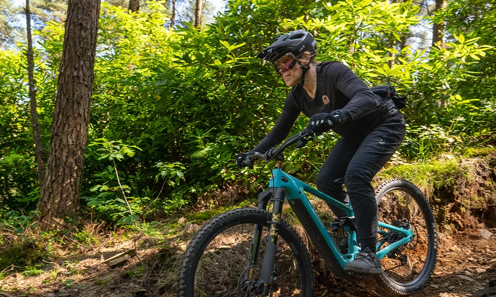 Woman riding yeti MTB in the woods
