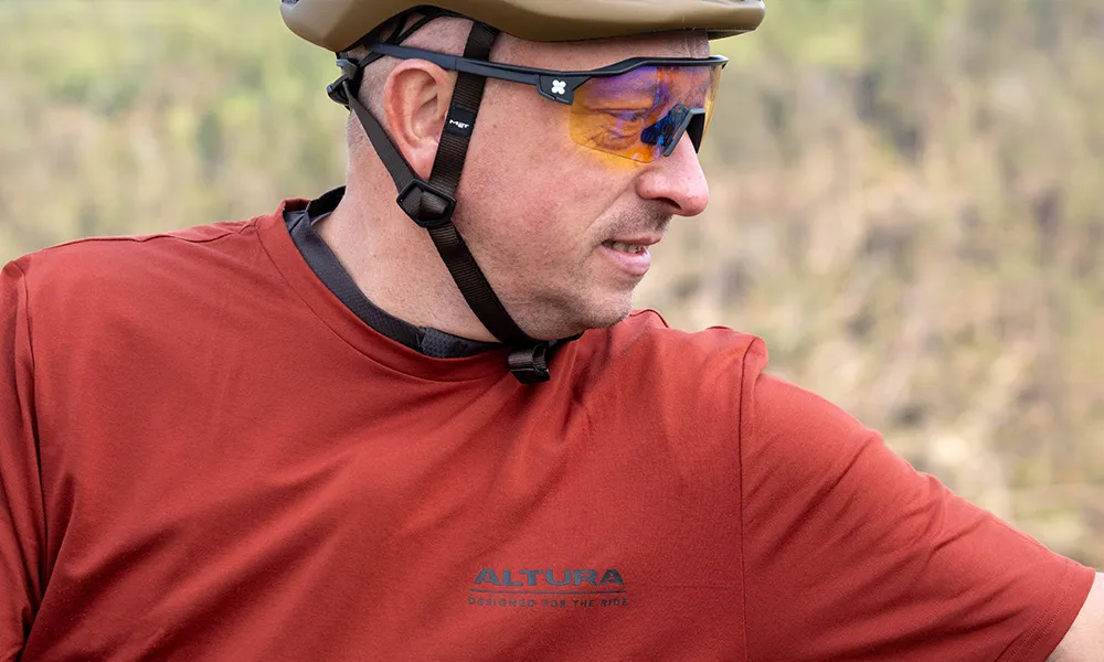 gravel rider wearing glasses on a sunny spring day close up