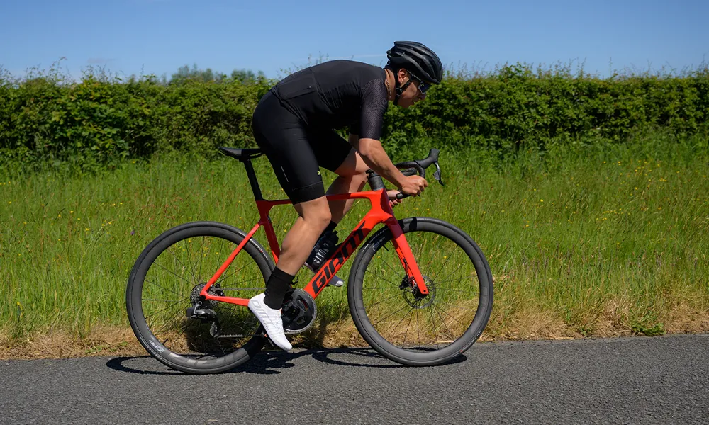 road rider sprinting on a sunny day
