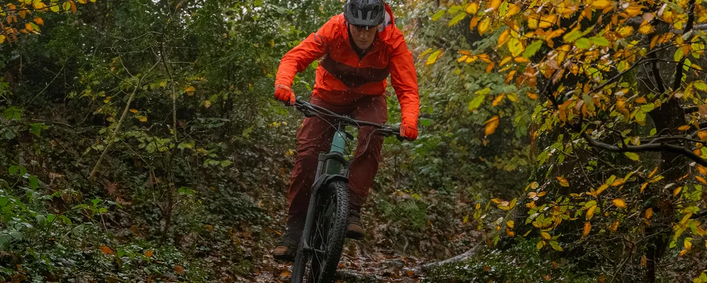 riding through trees on an e-bike with front mudguard