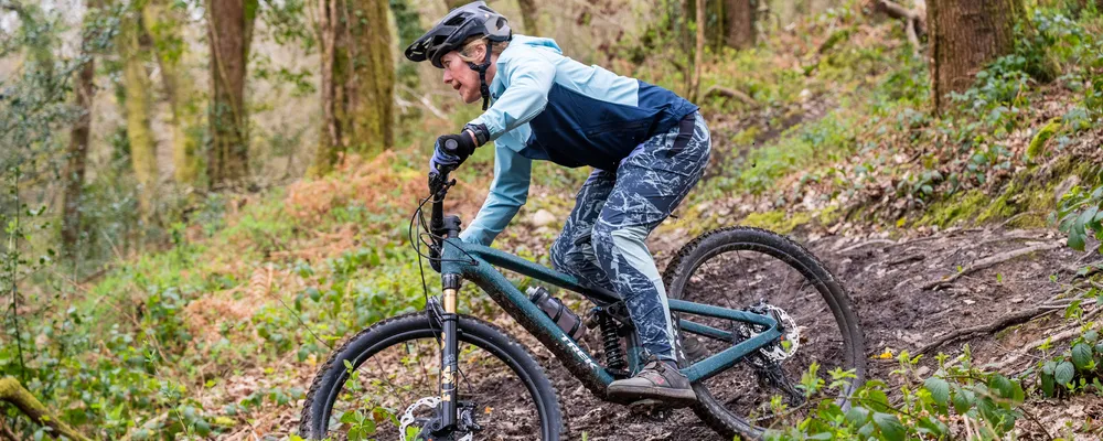 woman getting rad on a full suspension mountain bike - Trek Fuel LX
