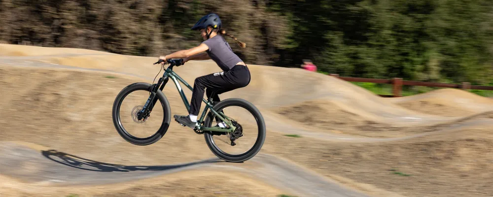 Girl riding a Liv bike at the pump track