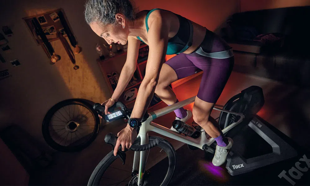 A cyclist using a Garmin computer for their home training