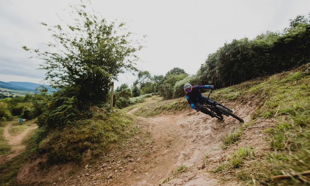 mountain biker on trail corner