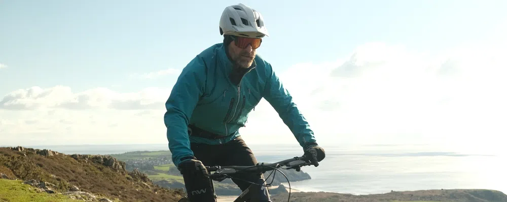 MTB rider in blue jacket