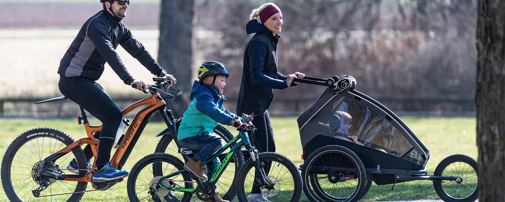 family with bikes and trailer