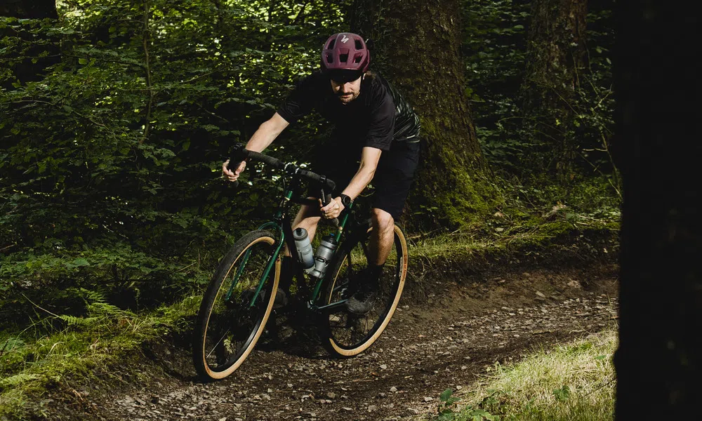 gravel bike on trail in the woods