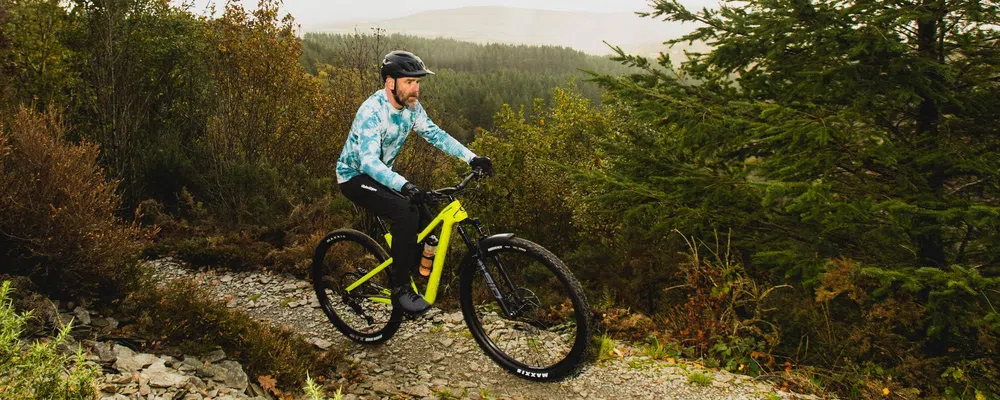 MTB rider on a cannondale wearing tie dye