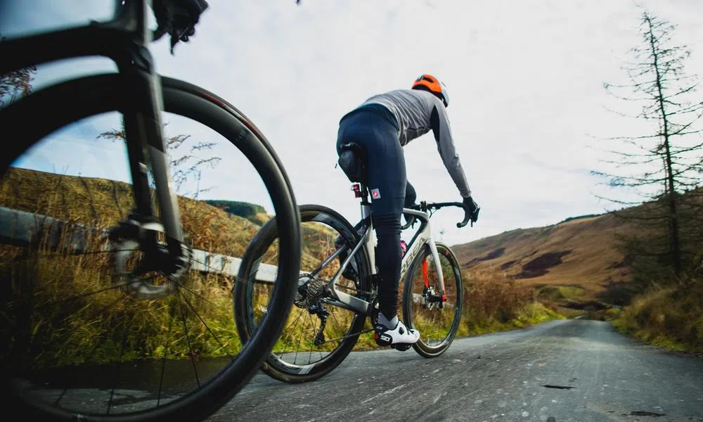 road riders on the brakes slowing down