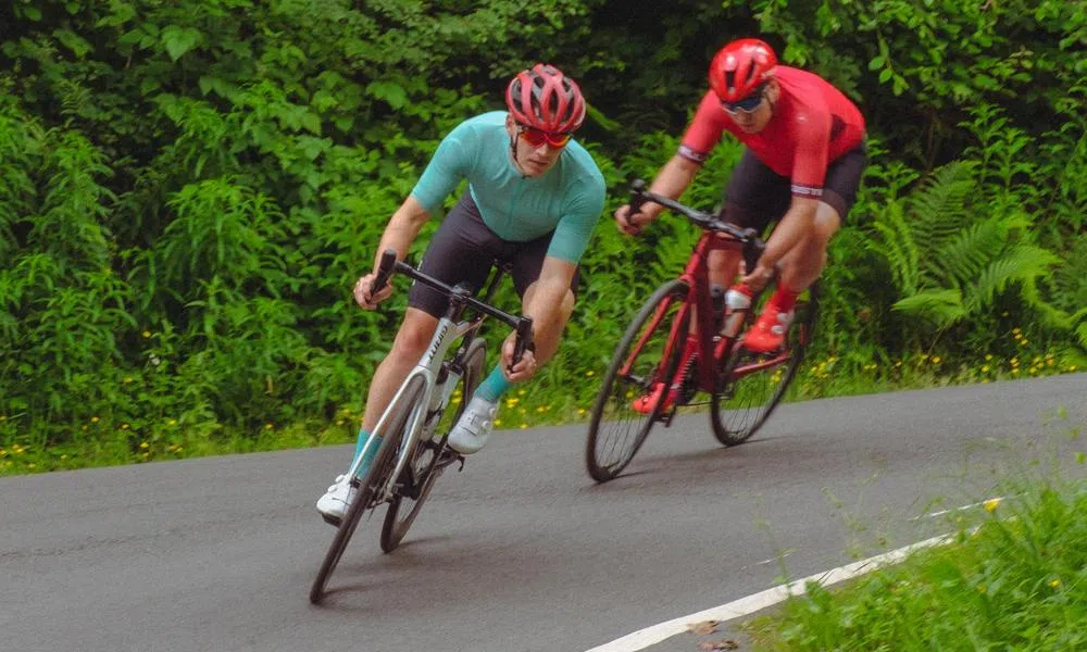 two road cyclists cornering