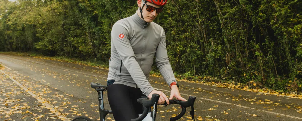 cyclist adjusting their bike computer