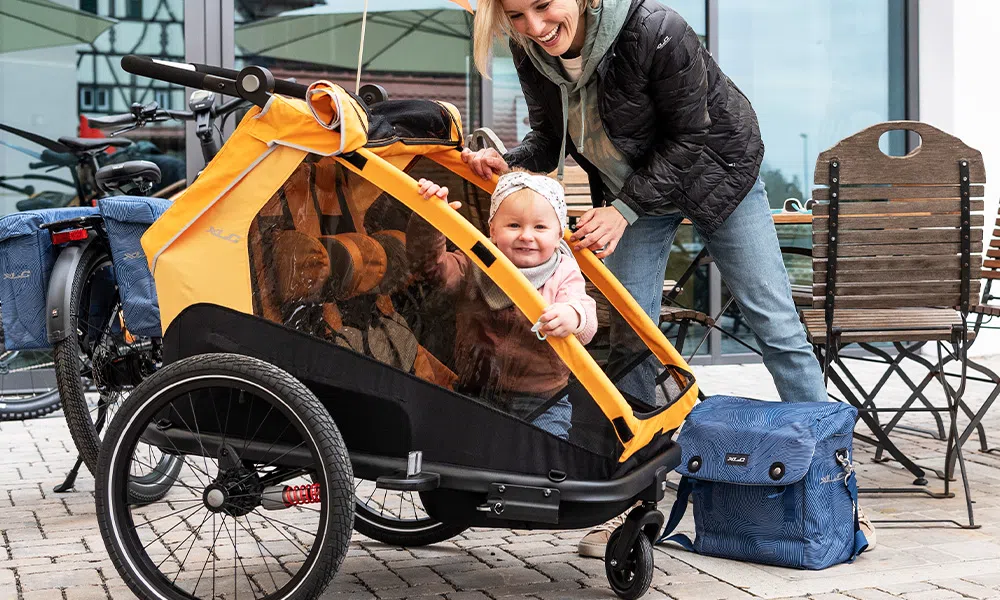 child in a bike trailer