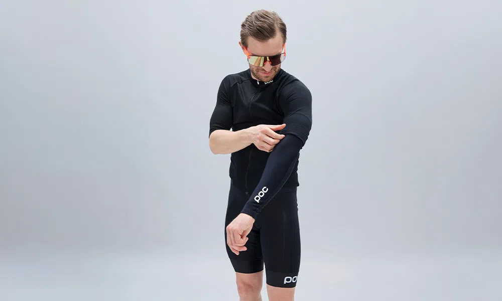 man wearing cycling arm warmers