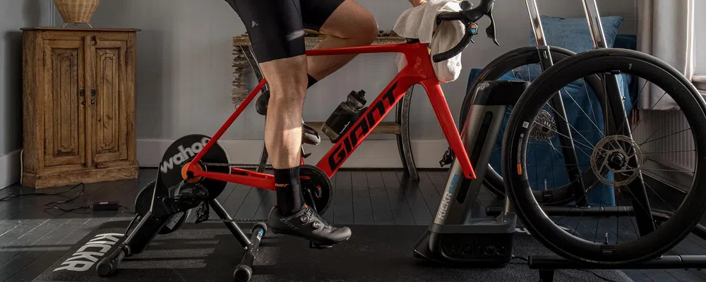 riding Wahoo indoor training set up with smart trainer, climb and desk