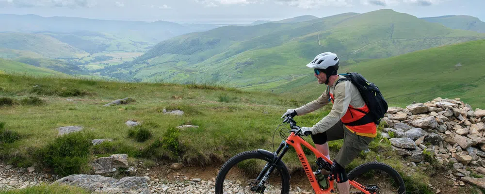 mountain biker riding up cadair idris in wales on a specialized levo sl