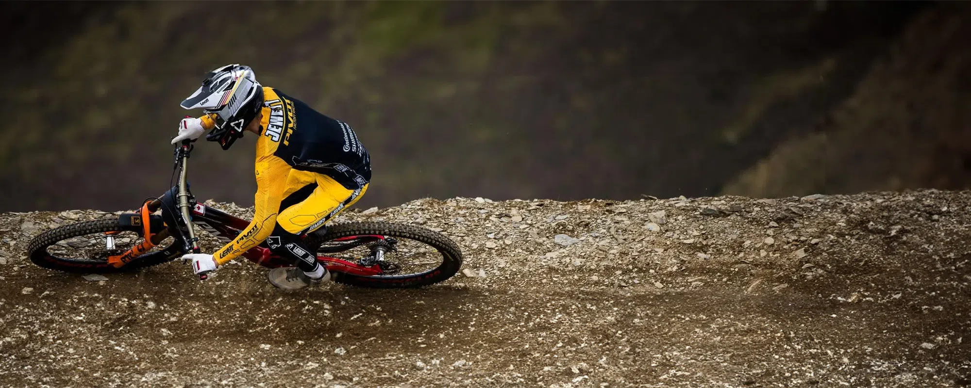 downhill mountain bike rider railing a berm in Leatt kit