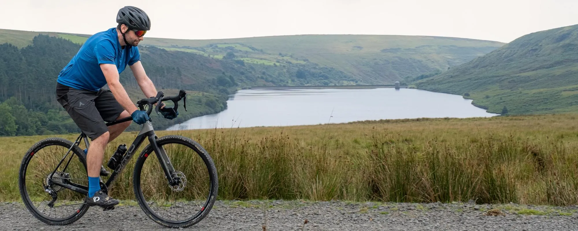 orro gravel bike on gravel road over looking lake 