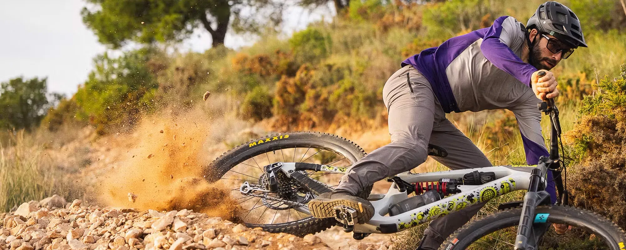 mountain bike on dusty corner rider in 7mesh purple 