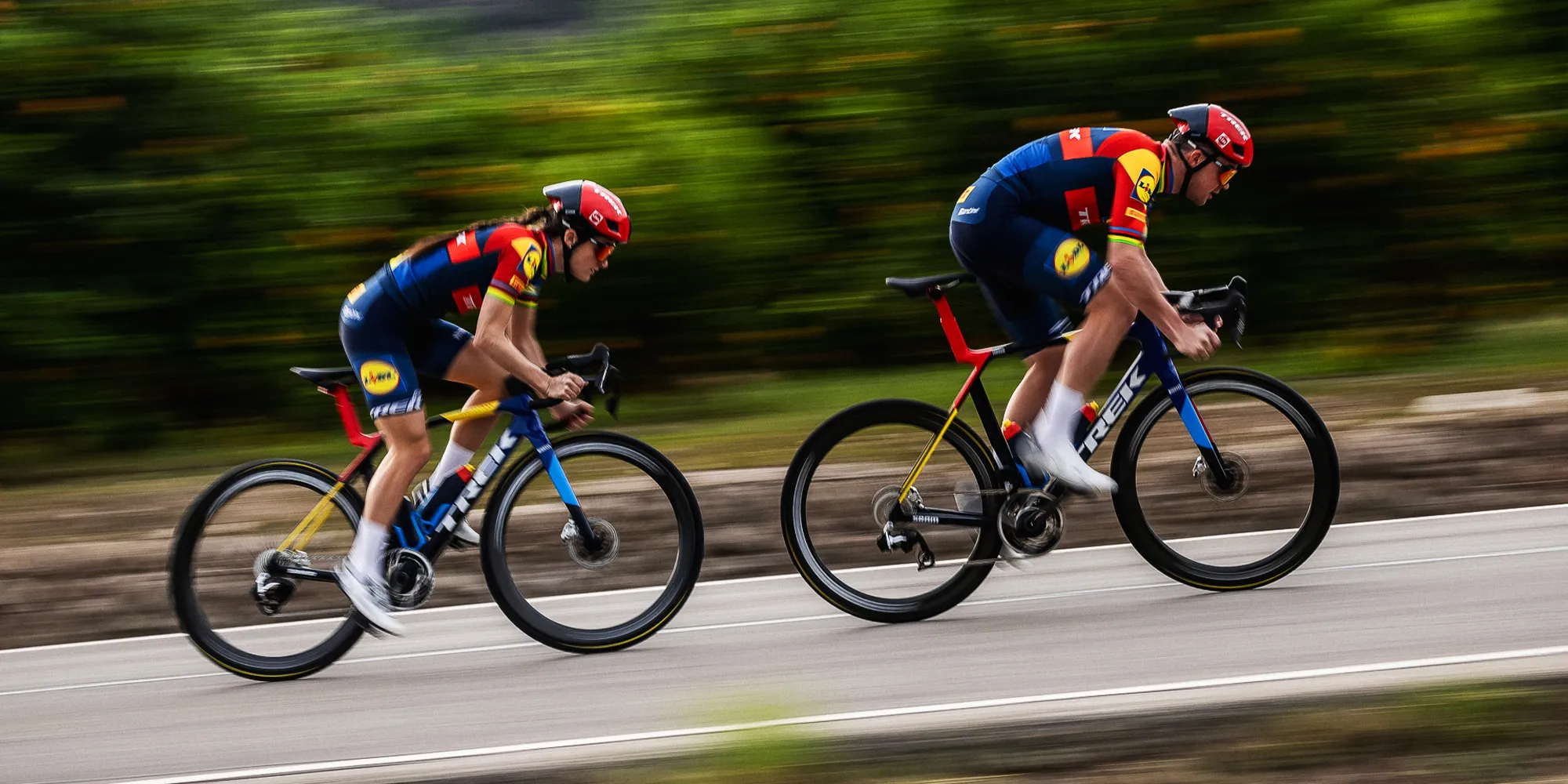 Two riders on Trek race bikes in lidl trek kit