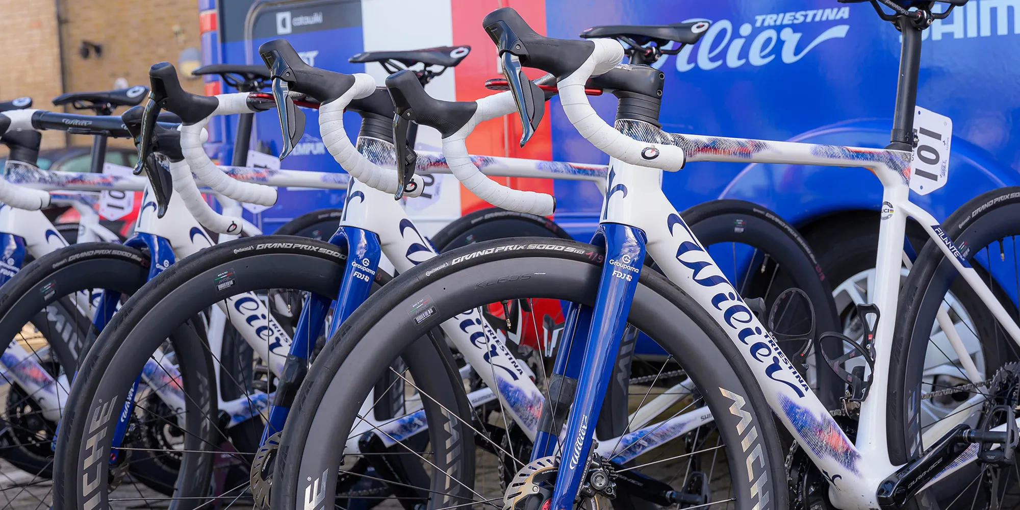 Wilier road race bikes with team groupama fdj bus in brackground